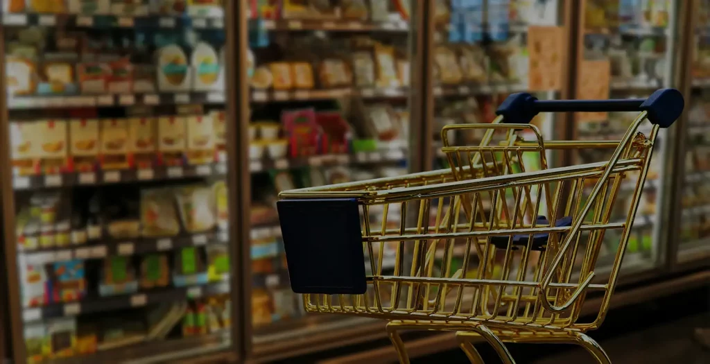 Shopping trolley in a supermarket aisle, linked to dwell time and basket size