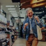 Shopper dancing in a supermarket aisle, showing how music lifts customer mood