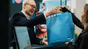 Man buying items from store after hearing instore radio