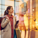 Shopper window shopping in shopping mall enhanced by DMX Africa's digital solutions and in-store messaging